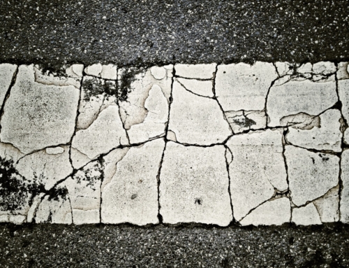 What causes a cracked driveway?